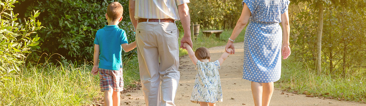 Closeup of grandparents and grandchildren walking