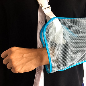 photograph of an arm in a sling.