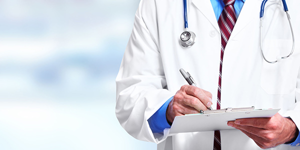 Photograph of a doctor with a clipboard